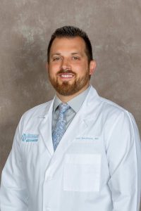 Dr. Rhett MacNeille