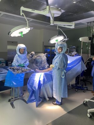 Two surgical team members smiling before procedure starts